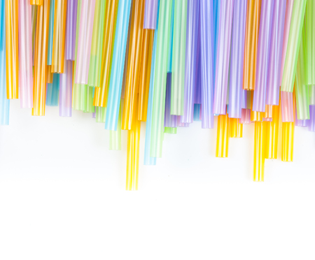 Drinking straw colorful plastic tubes over white as abstract backgroundの写真素材