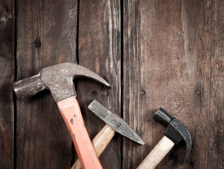 hammer on a wood boardの写真素材