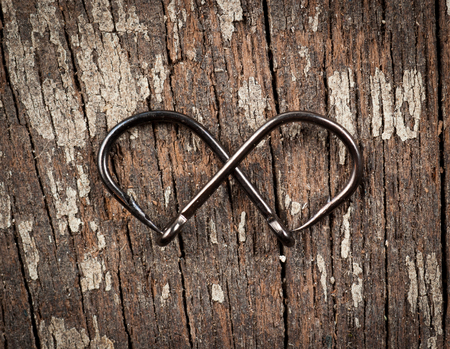 fish hook on wood backgroundの写真素材