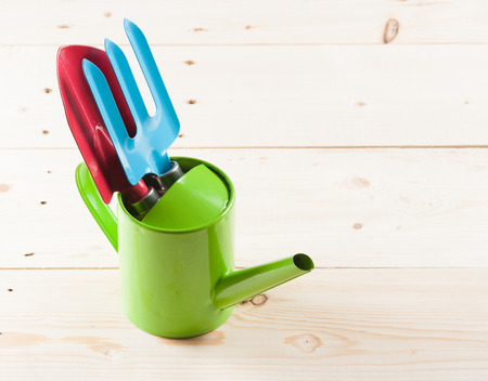 Gardening tools on wooden backgroundの写真素材