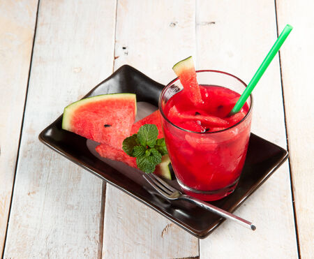 Fresh water melon drink on woodの写真素材
