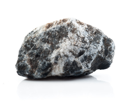Fragment of granite on a white background.の写真素材