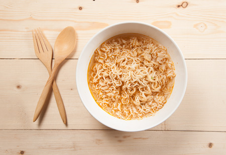 Instant noodles on wood baordの写真素材