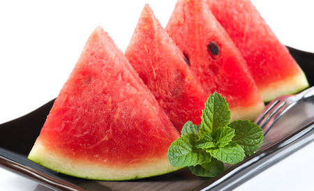 water-melon on a plate on a white backgroundの写真素材