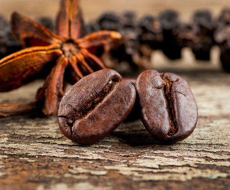 coffee grains on grunge wooden backgroundの写真素材