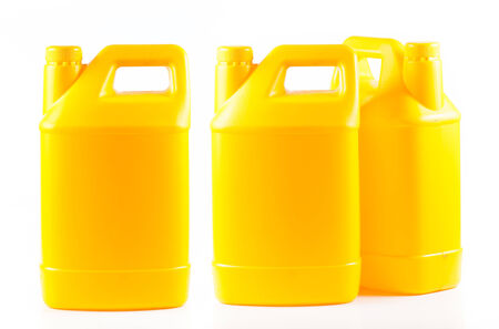 Yellow plastic container isolated on a white background.の写真素材