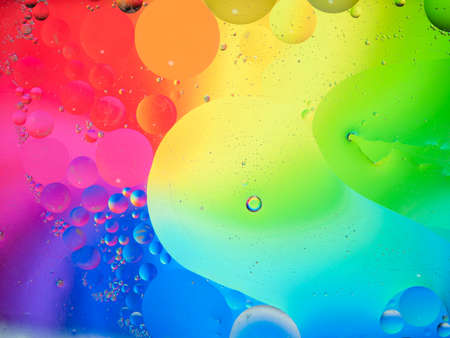 Background of colorful oil drops in waterの写真素材