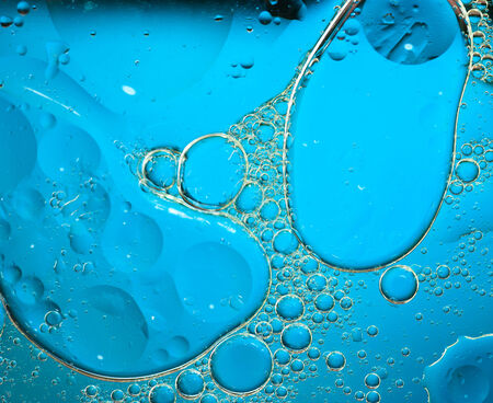 Oil drops on a water surfaceの写真素材