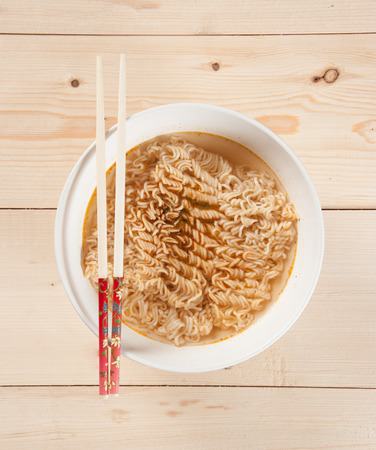 Instant noodles on wood baordの写真素材