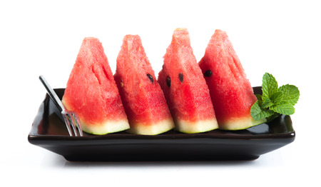 water-melon on a plate on a white backgroundの写真素材