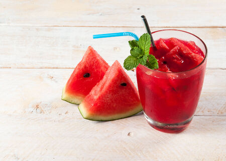 Fresh water melon drink on woodの写真素材