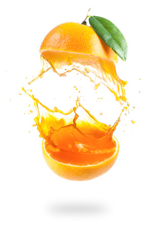 Orange juice splashing isolated on white