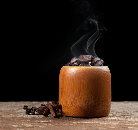 Coffee beans roasting with smokeの写真素材