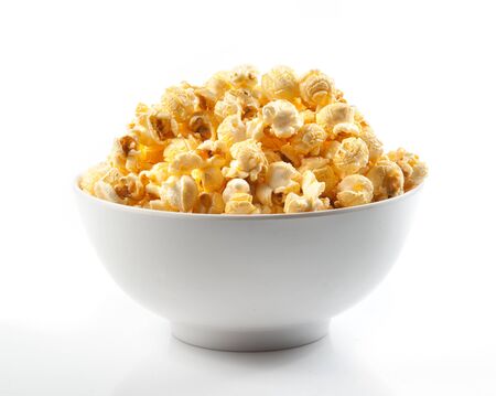 Popcorn in a bowl on white backgroundの写真素材