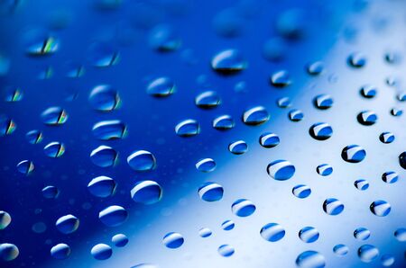 Background of water drops on glassの写真素材