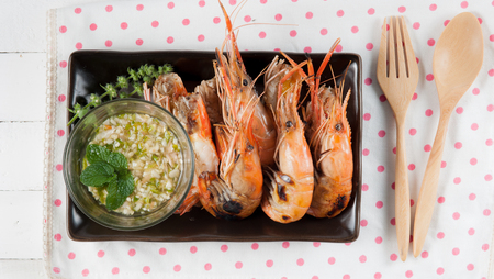 steamed shrimp with sauce on a white backgroundの写真素材