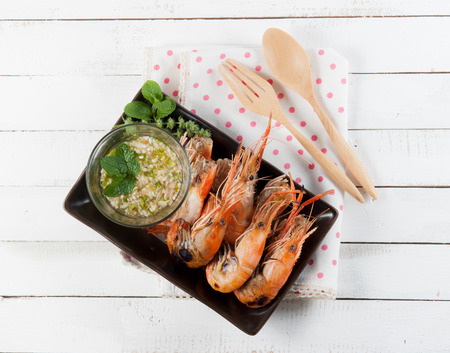 steamed shrimp with sauce on a white backgroundの写真素材