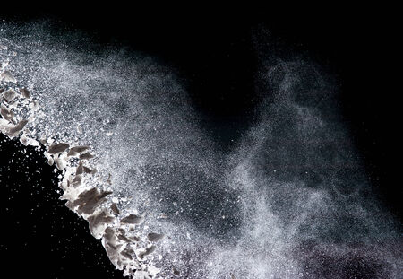 Flour on black backgroundの写真素材