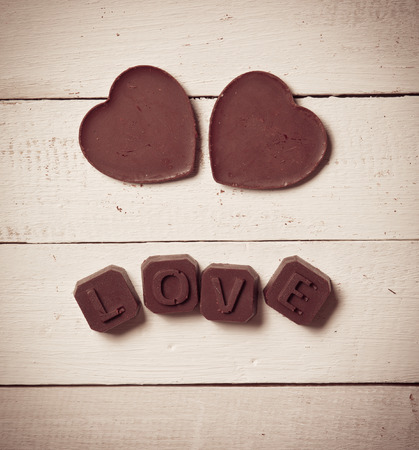 chocolate Valentine's on rusty wooden,vintage color toned imageの写真素材