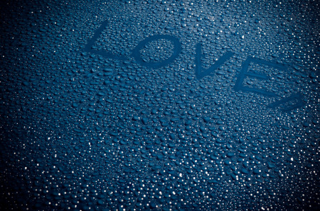 Valentine 's Day Love heart made by water bubbles on a blue backgroundの写真素材