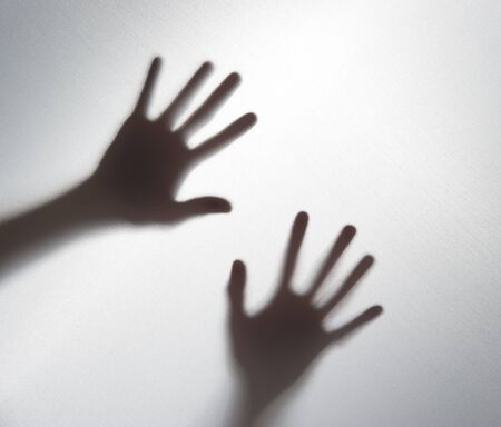 Silhouette of a hand in the back light,blur image