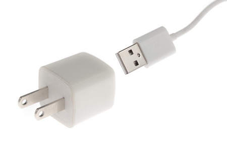 White adapter Charger with usb cable on white backgroundの写真素材