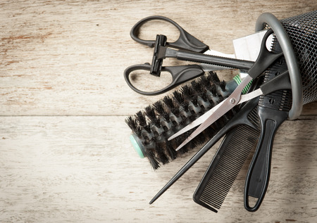hairdresser tools on white woodの写真素材