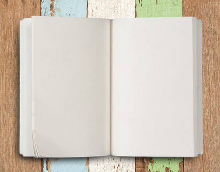 Open book on wood backgroundの写真素材