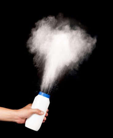 spilled powder on black backgroundの写真素材