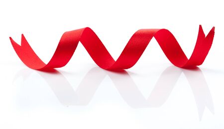 fabric red ribbon on a white backgroundの写真素材