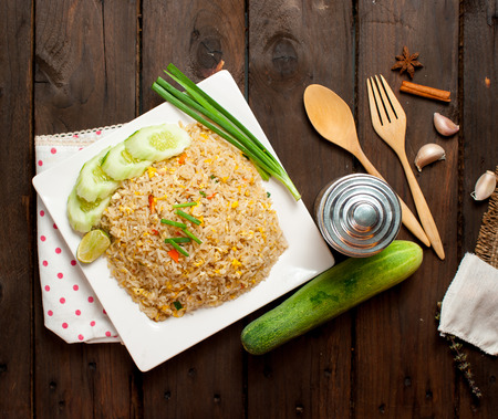 Fried Rice Thailand  and Vegetables on wood tableの写真素材