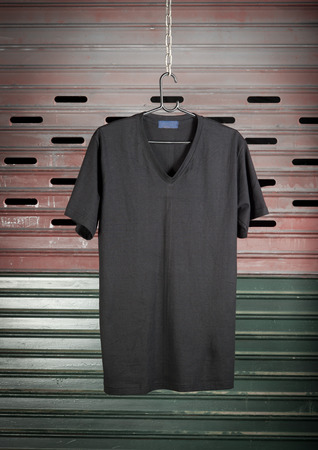 Black t-shirt hanging on steel Doorの写真素材