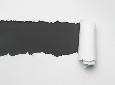 Torn white paper with black spaceの写真素材