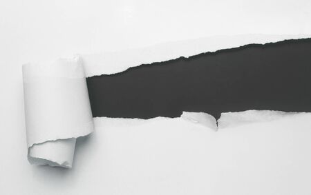 Torn white paper with black spaceの写真素材