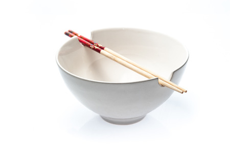 Chopstick and White bowl isolated on white backgroundの写真素材