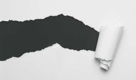 Torn white paper with black spaceの写真素材