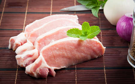 Meat, pork, slices pork loin on woodの写真素材