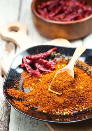 Cayenne pepper spice on wooden tableの写真素材