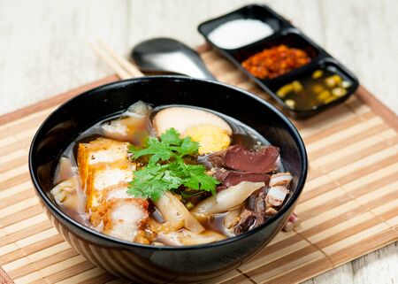 egg pork paste of rice flour, boiled Chinese pasta square on tableの写真素材