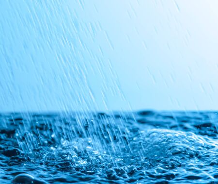 falling rain cast in a blue light,Motion blurの写真素材