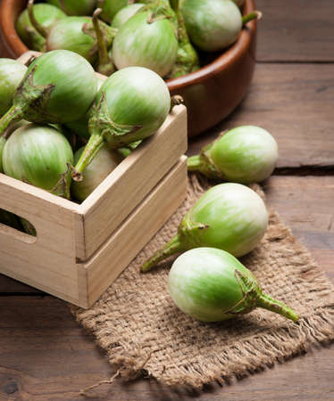 Ripe eggplant on a wooden table.の写真素材