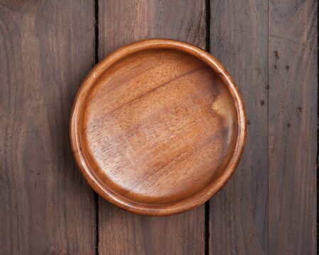 wooden bowl on wooden background,Top viewの写真素材