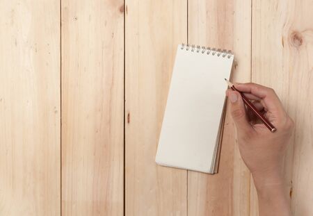 Empty Plate on wooden background. Top View with Text Spaceの写真素材