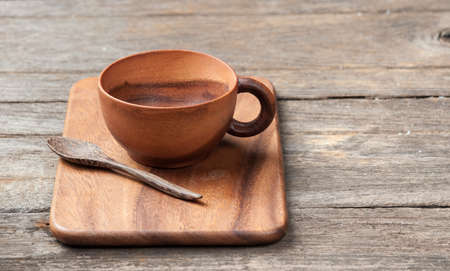 Wooden tea cup on table woodの写真素材