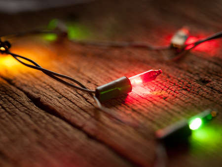 christmas light decor on wood background, selective focus