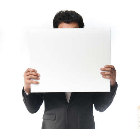 businessman holding a white board