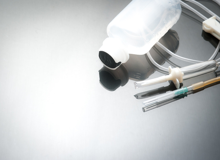 Saline IV drip on dark backgroundの写真素材