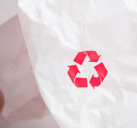 Recycling logo on white plastic recycledの写真素材