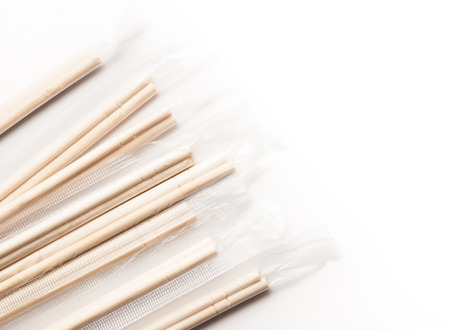 Wooden pairs of chopsticks on white backgroundの写真素材