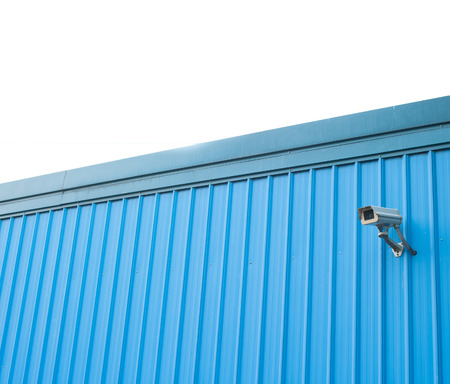 Security cctv camera in metal wall